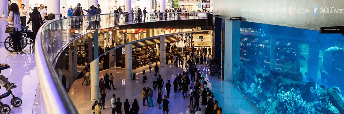 people shopping and walking at the dubai mall