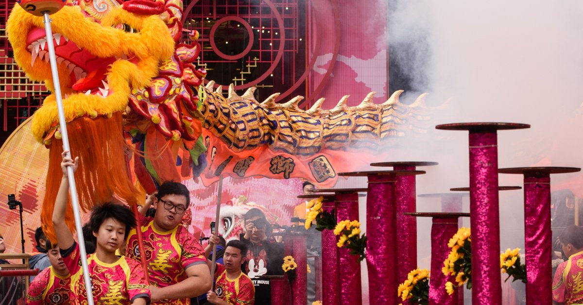 people celebrating the dragon as part of the chinese new year 