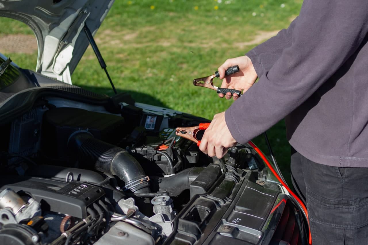 a man repairing car