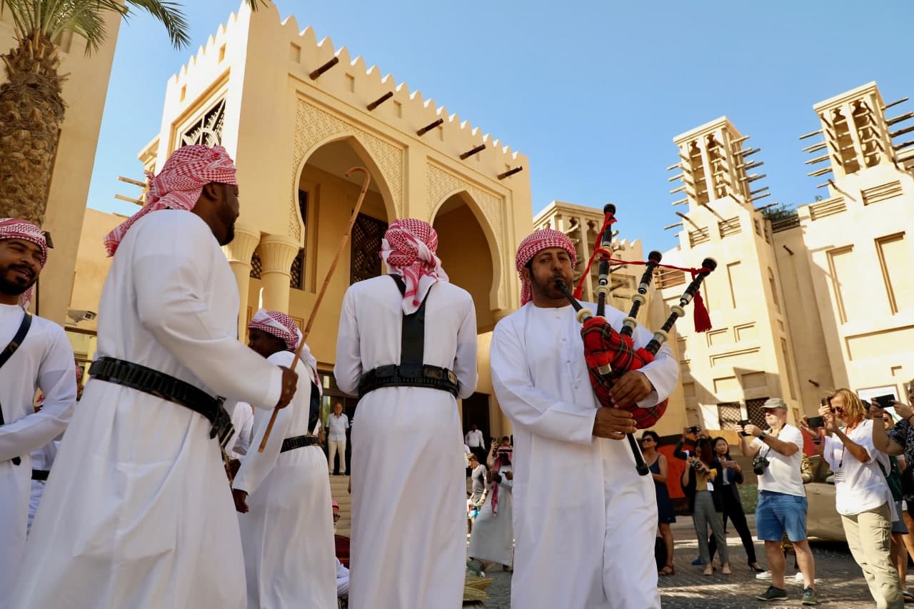 Emirati men plating bagpipes in Souk Madinat Jumeirah, Dubai